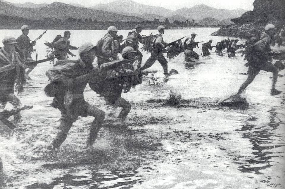 Chinese troops crossing the Imjin River during the Korean War